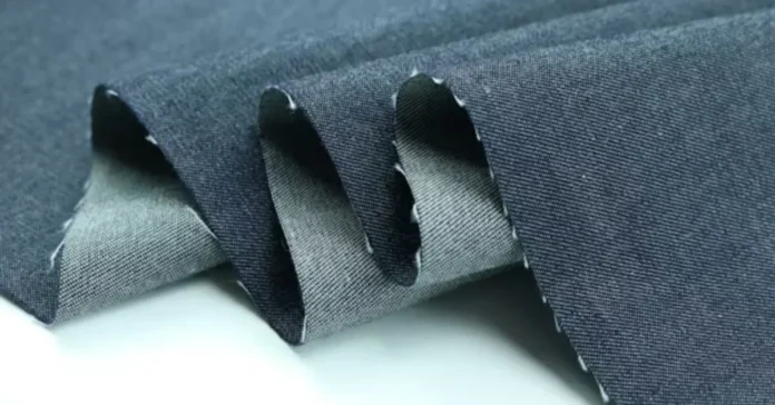 Close-up texture of chambray fabric showing lightweight plain weave structure.