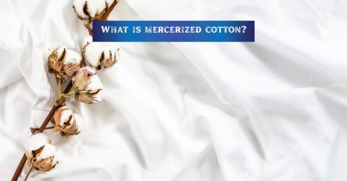 A white fabric with cotton flower on it___what is mercerized cotton?