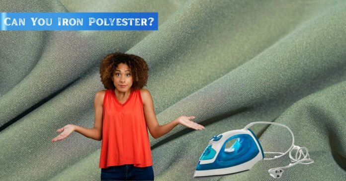 Confused woman standing in front of polyester fabric background with an iron beside her, asking 