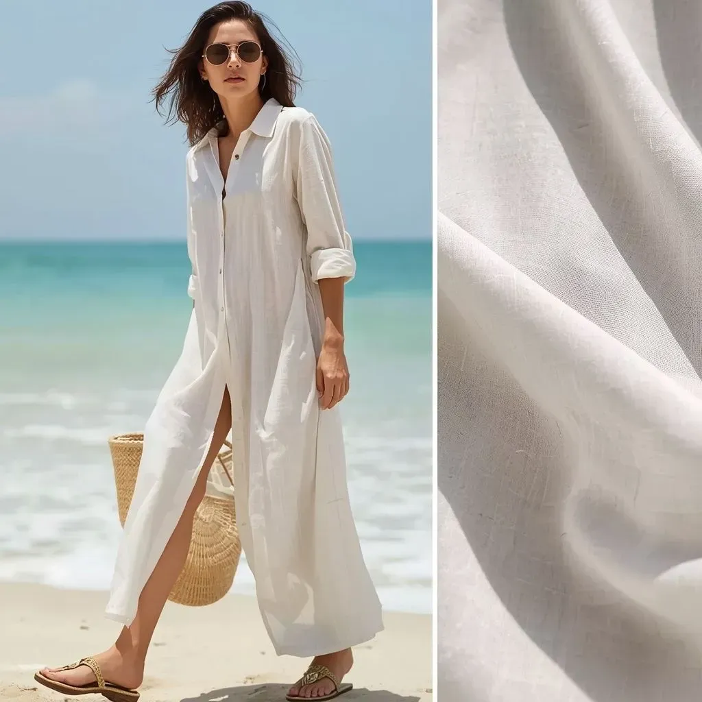 Loose slub cotton beach dress flowing in ocean breeze at resort.