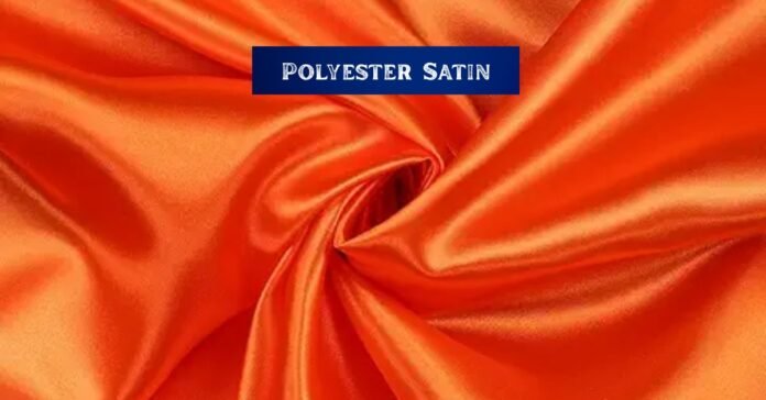 Bright orange fabric with a glossy finish, illustrating what is polyester satin?