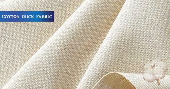 Close-up view of natural-colored cotton duck fabric with a visible plain weave texture.