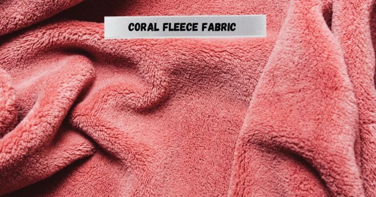 Close-up of soft coral fleece fabric in pink.