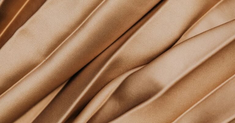 Smooth, glossy folds showing what is satin silk fabric? texture and shine.