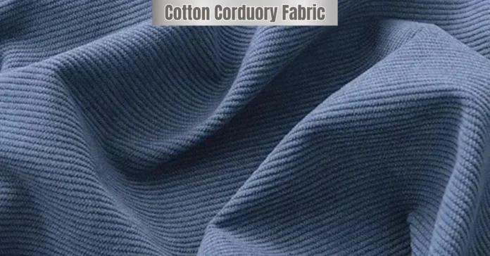 Close-up of cotton corduroy fabric showing fine ribbed texture and soft folds