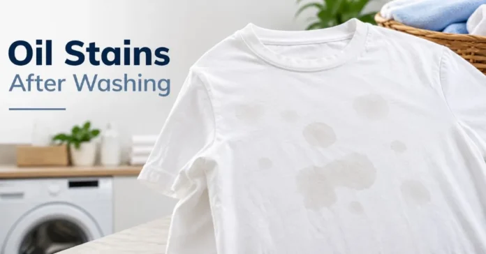 White T-shirt with light oil stains after washing in a clean laundry room.