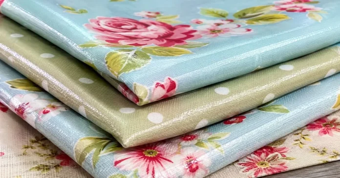 Close-up of glossy oilcloth fabric with a floral pattern