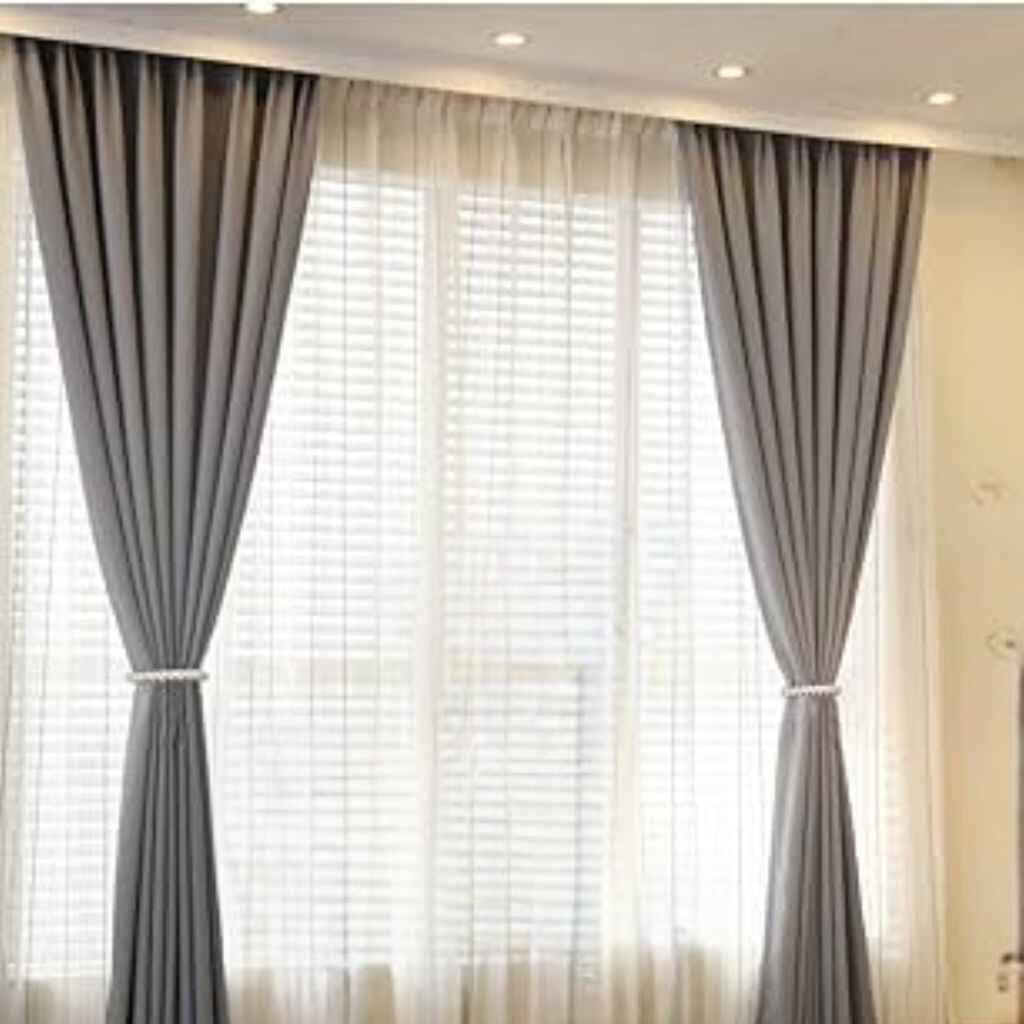 Tie-back draping with decorative ties holding the curtains.