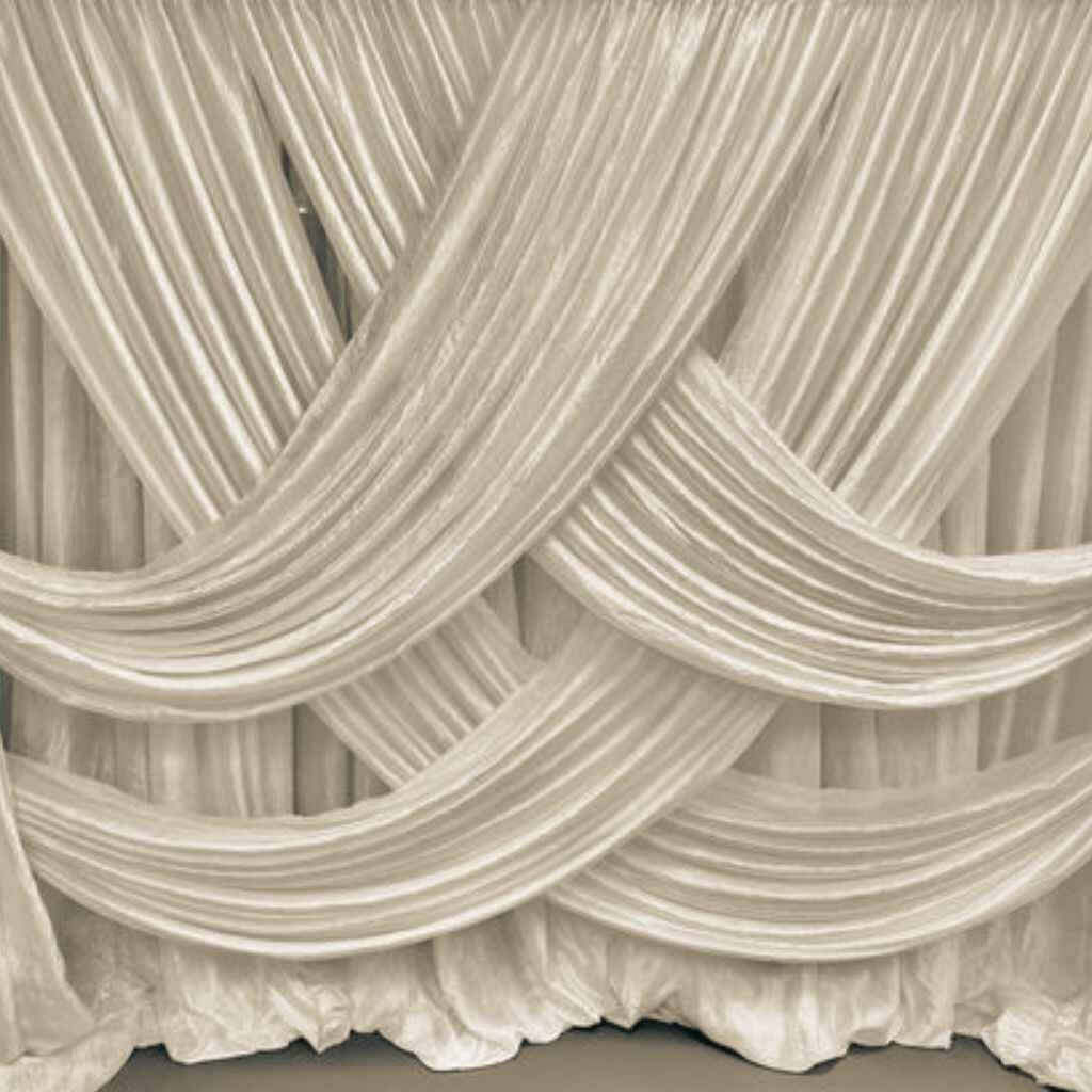 Layered draping with multiple curtains for depth and texture.