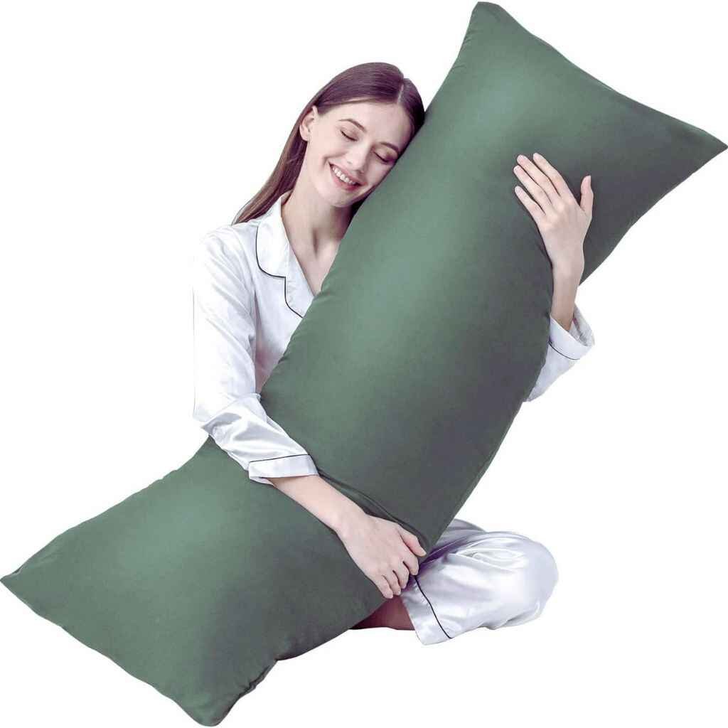 Long body cushion offering full-body support on a neatly arranged bed.