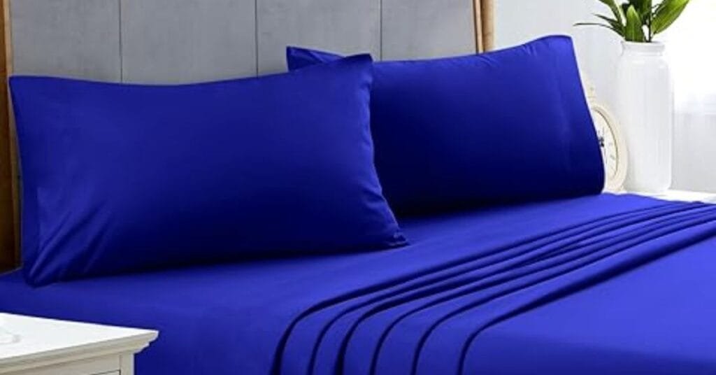 Bold cobalt blue bedsheets adding intensity.