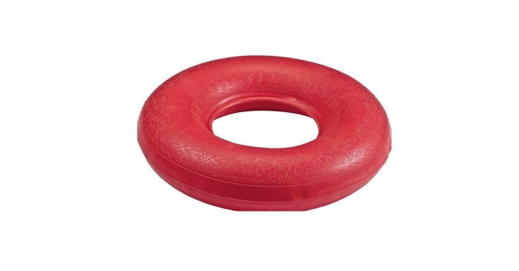 Inflatable doughnut cushion with adjustable firmness on a seat