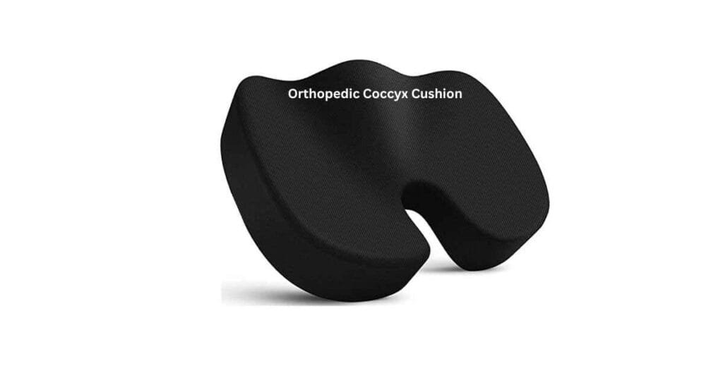 Orthopedic cushion with U-shaped cutout for tailbone pressure relief.