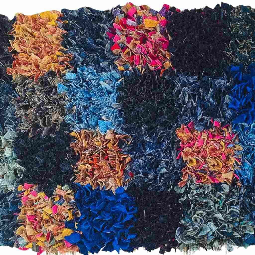 Patchwork rag rugs with colorful fabric sections.