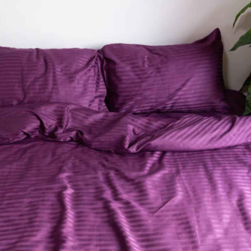 Amethyst purple sheets for a regal look.