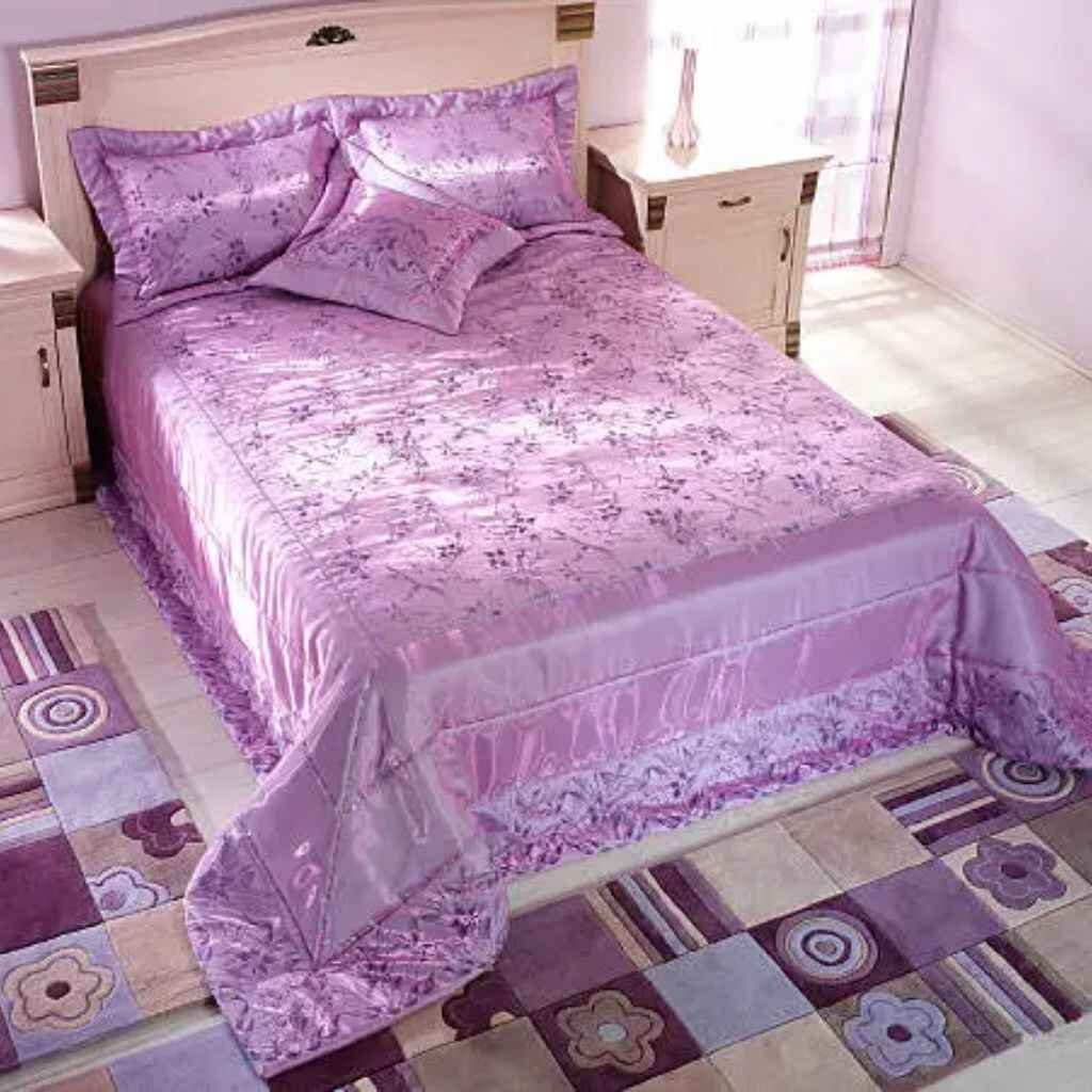 Deep purple silk sheets adding sleek sophistication.