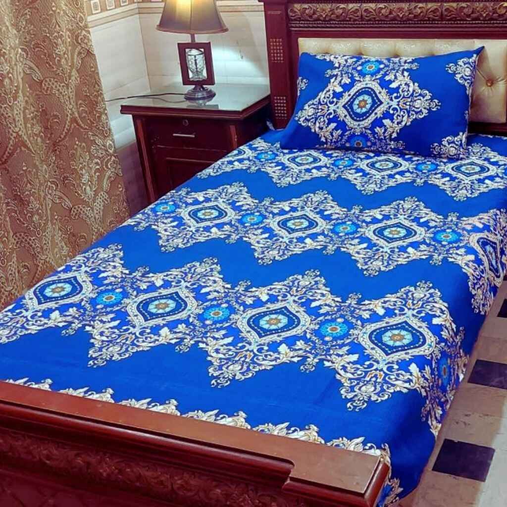 A neatly spread single bedsheet in a cozy, compact bedroom setting.