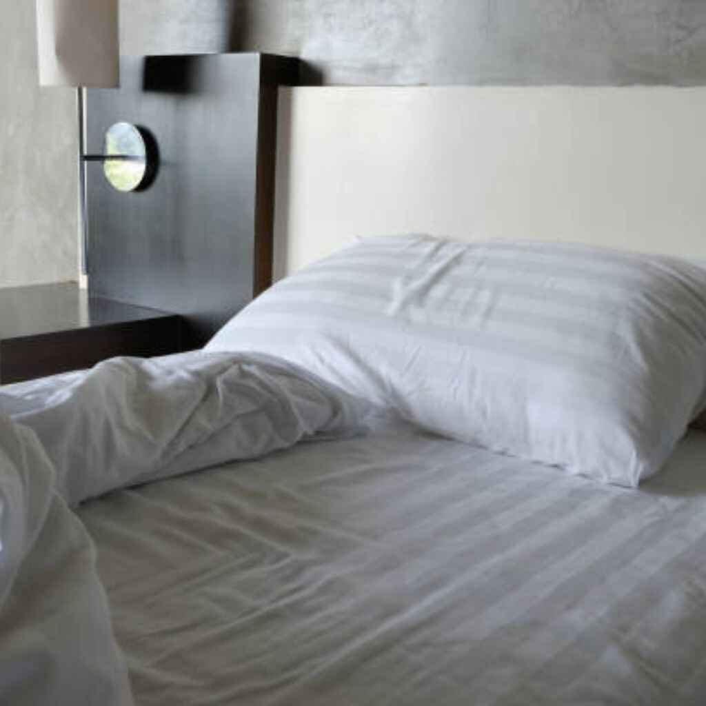 Simple patterned bed sheets with minimalist lines for a clean look.