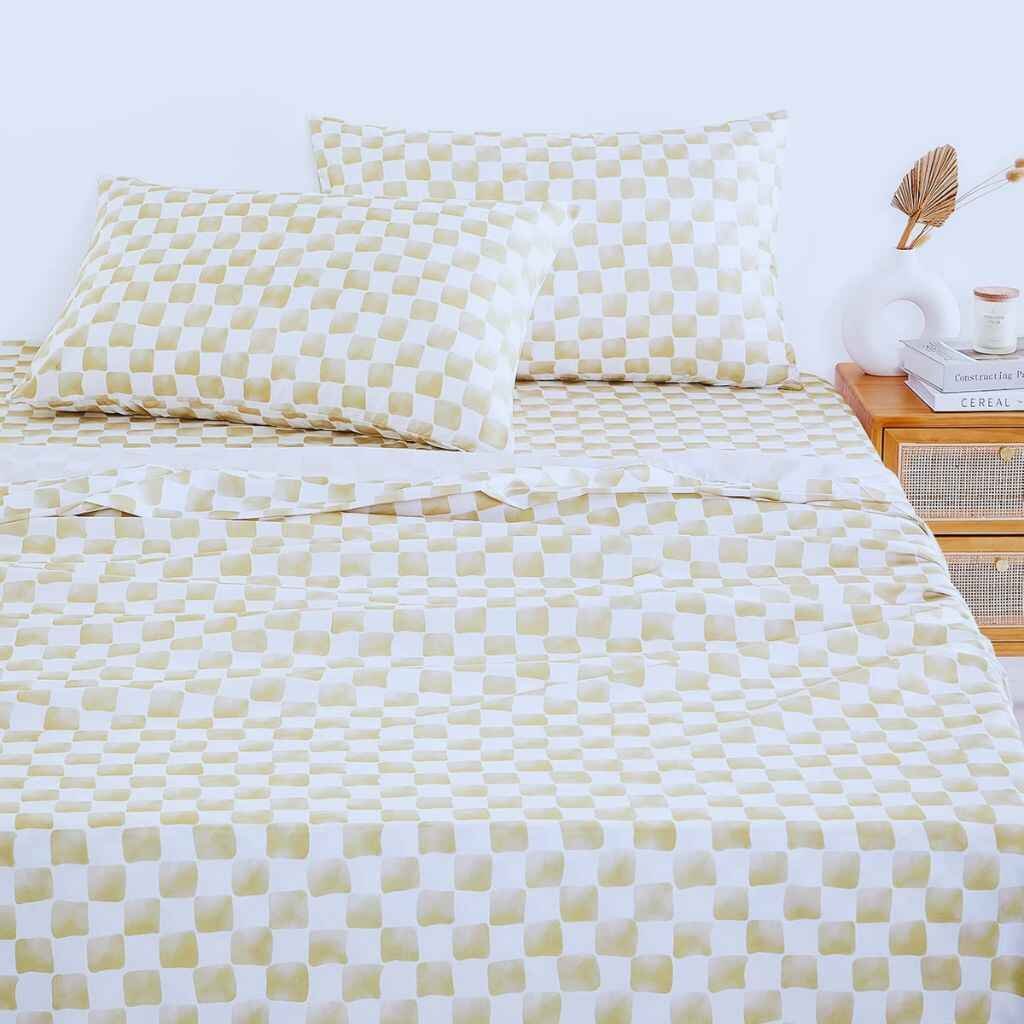 Rustic plaid patterned bed sheets adding warmth to the bedroom.